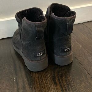 Black Ugg boots. Size 8. There is some slight fading and needs a good cleaning.